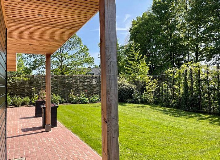 Cozy living room of Holiday home in Bruchterveld, Vechtstreek, Overijssel with wooden interior and comfortable seating.