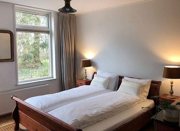 Gezellige eetruimte in Vakantiehuisje in Den Velde, Overijssel, met uitzicht op de Vechtstreek en een warme, landelijke sfeer.