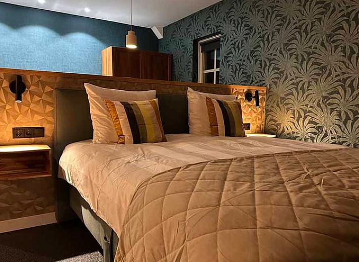Cozy sitting area with fireplace in Cottage in Kloosterhaar, Vechtstreek, Overijssel.