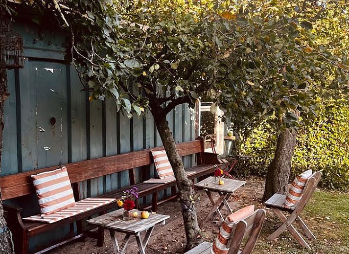 Cozy living room of cottage in Kloosterhaar, Vecht region Overijssel, with modern decor and lots of natural light.