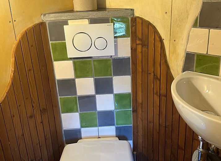 Gezellige binnenruimte van Huisje in Punthorst, vakantiehuis in Vechtstreek, Overijssel met houtkachel.