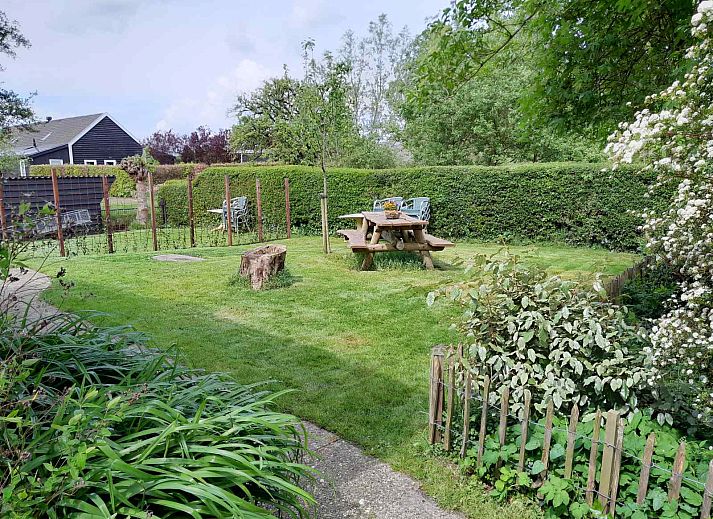 Bedroom in OV602 vacation home in Giethoorn with comfortable beds and skylight.