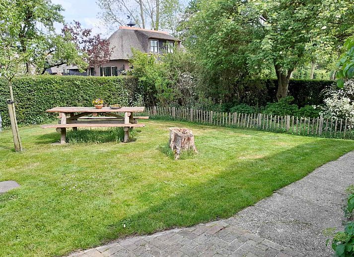Bedroom in OV602 vacation home in Giethoorn with comfortable beds and skylight.