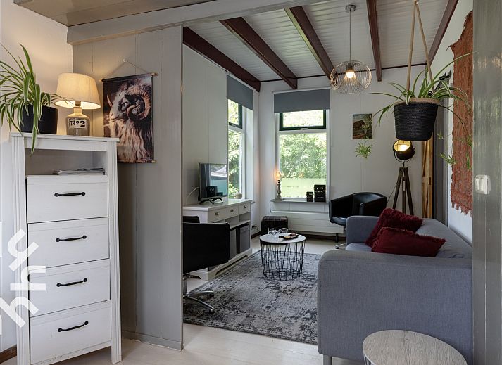 Attractive bedroom in vacation home OV480 in Giethoorn, Overijssel, with comfortable bed and view of green nature.