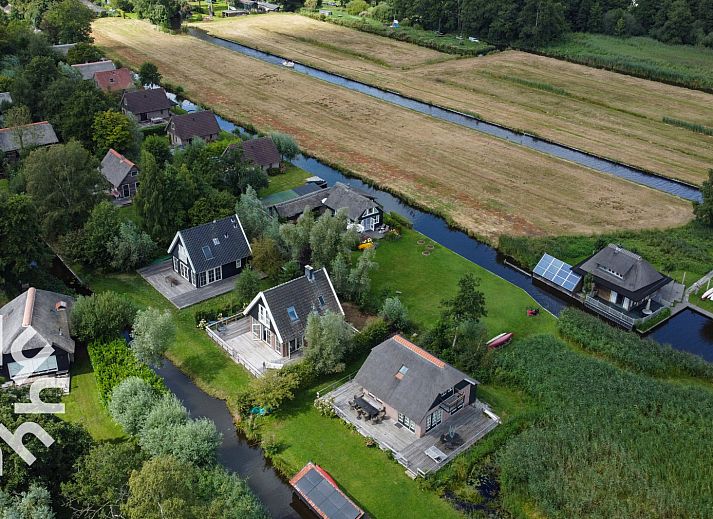 Spacious terrace of vacation home OV688 in Giethoorn, Northwest Overijssel, perfect for relaxing outdoor seating.