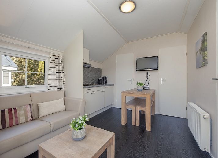 Porch of Tiny House 2 chalet in Giethoorn, Northwest Overijssel, surrounded by green nature and rustic charm.