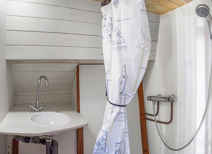 Cozy dining area in Holiday Home in Zwartsluis, Northwest Overijssel, with wooden interior and comfortable seating area.