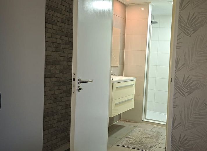 Cozy living room of Holiday home in Zwartsluis, Overijssel, with comfortable seating area and views of the serene nature.