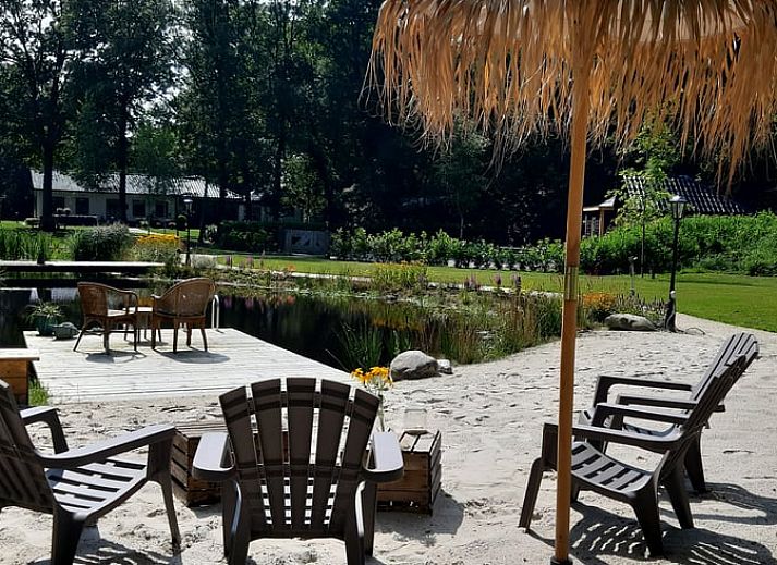 Enjoy a picnic by the water at Holiday Home in De Bult, Northwest Overijssel, with an attractive terrace and natural surroundings.