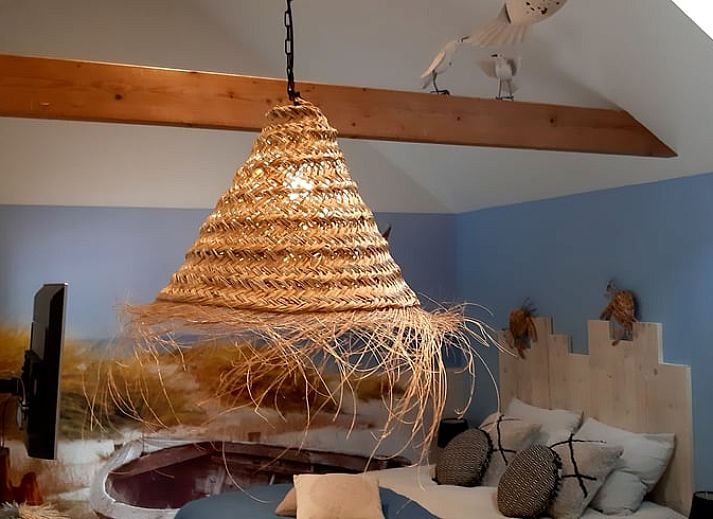 Blooming flowers and a peaceful pond at Holiday Home in De Bult, Overijssel, offer picturesque views from the terrace.