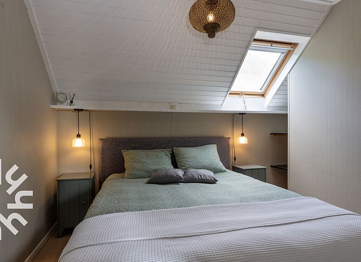 Gemuetliches Wohnzimmer des Ferienhauses OV591 in Wanneperveen, Overijssel mit komfortabler Sitzecke.