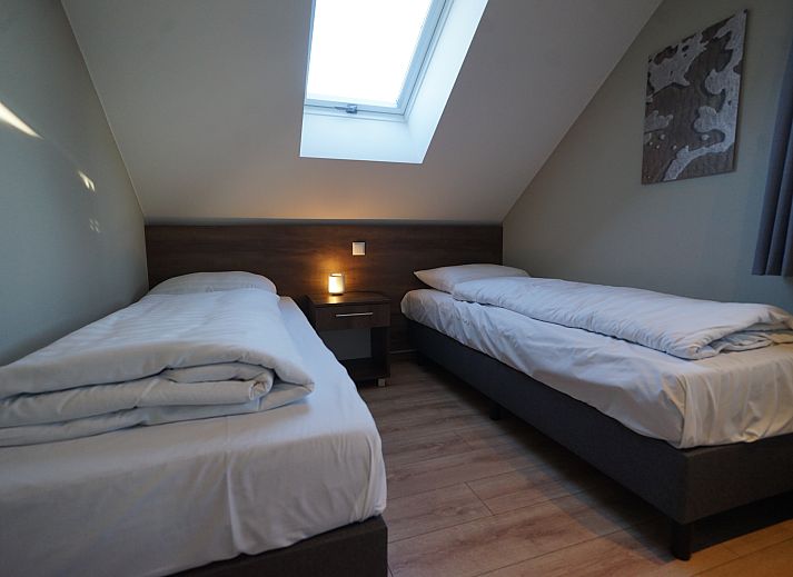 Indoor area of Chalet in Kampen, comfortable sitting area overlooking the green surroundings in Northwest Overijssel.