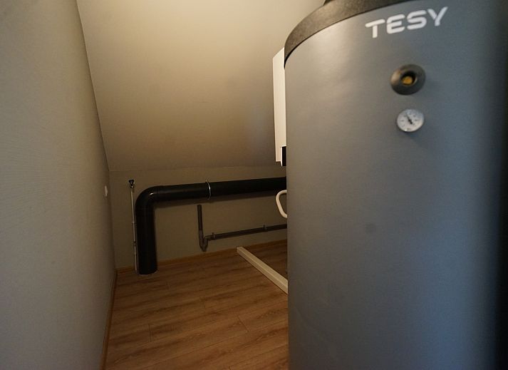 Indoor area of Chalet in Kampen, comfortable sitting area overlooking the green surroundings in Northwest Overijssel.