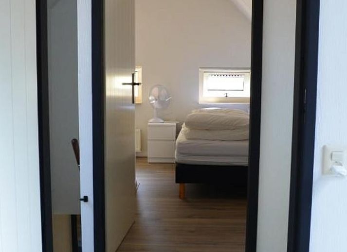 Treppe mit Holzgelaender in einem Ferienhaus in IJhorst, Nordwest Overijssel.