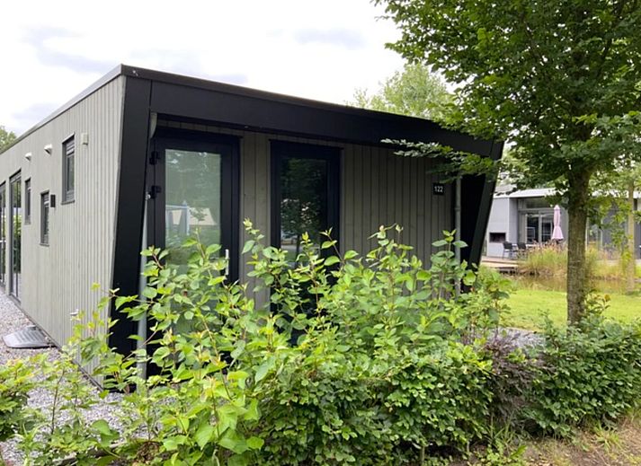 Detached house in IJhorst, a modern vacation home surrounded by nature in Northwest Overijssel, with a spacious veranda and green views.