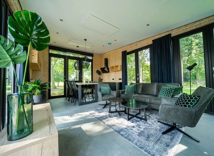 Detached house in IJhorst, a modern vacation home surrounded by nature in Northwest Overijssel, with a spacious veranda and green views.