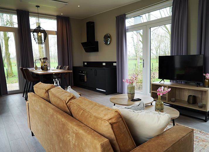 Detached house in IJhorst, Northwest Overijssel, offers a modern vacation home with a beautiful terrace surrounded by nature.