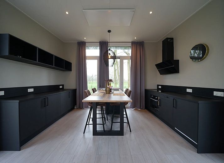 Detached house in IJhorst, Northwest Overijssel, offers a modern vacation home with a beautiful terrace surrounded by nature.