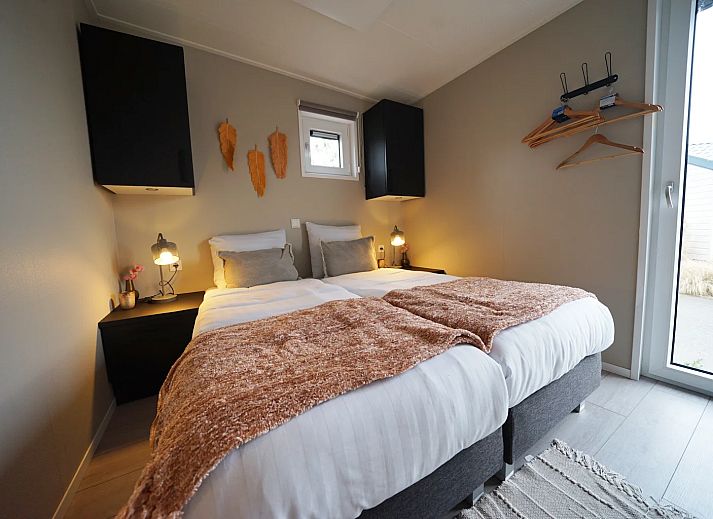 Cozy bedroom in detached house in IJhorst, Overijssel, with comfortable beds and mood lighting.