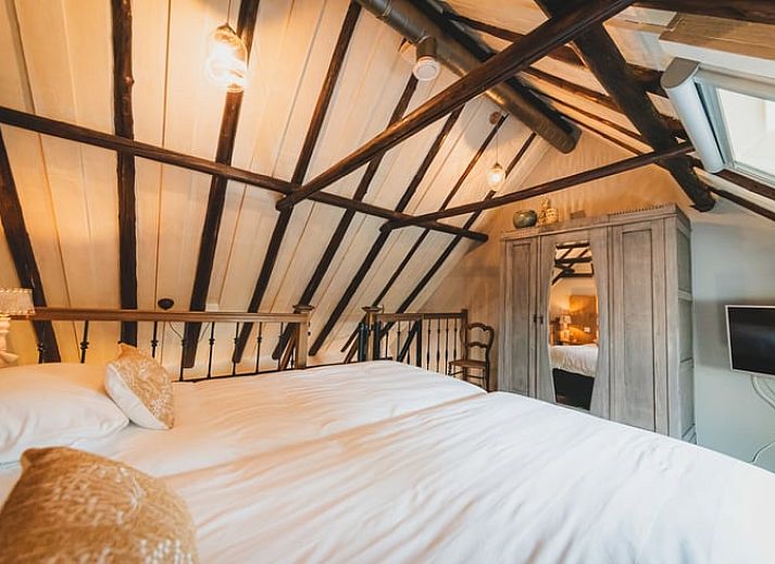 Gezellige binnenruimte van Vakantiehuis in Sint Jansklooster, Overijssel, met rustieke inrichting.