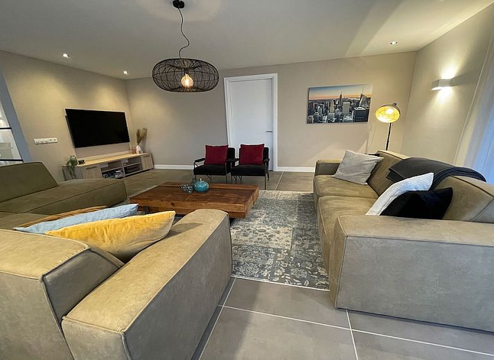 Bedroom in Family Villa 12, a vacation home in Ossenzijl, Overijssel, with views of nature through large windows.