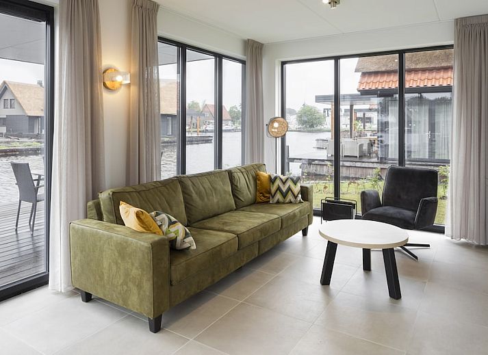 Discover Watervilla 6A, a charming waterfront vacation home in Ossenzijl, Northwest Overijssel, with stunning views of nature.