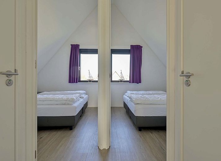 Uitzicht vanaf het terras van de vakantiewoning in Ossenzijl, met water en natuur in Overijssel.