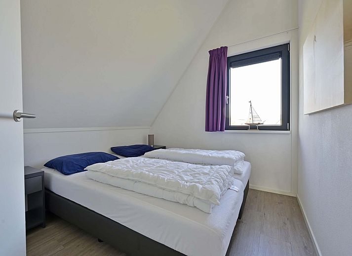 Uitzicht vanaf het terras van de vakantiewoning in Ossenzijl, met water en natuur in Overijssel.