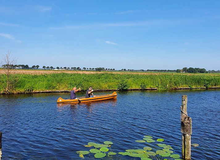 Attractive bedroom in OV684 vacation home, Blokzijl, with colorful flower wallpaper, Northwest Overijssel.