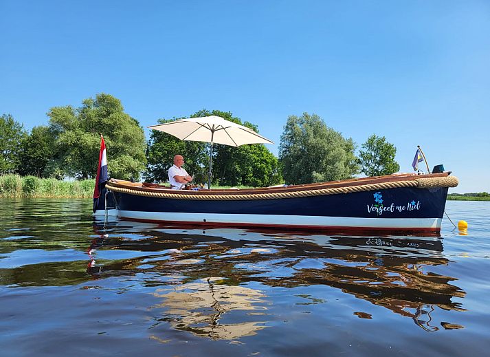 Picturesque view of frozen water and historic buildings in Blokzijl, near OV686 vacation home.