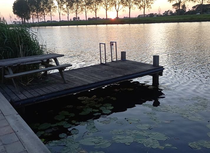 Enjoy the terrace at Holiday Home in IJsselmuiden, located on the water in Northwest Overijssel.