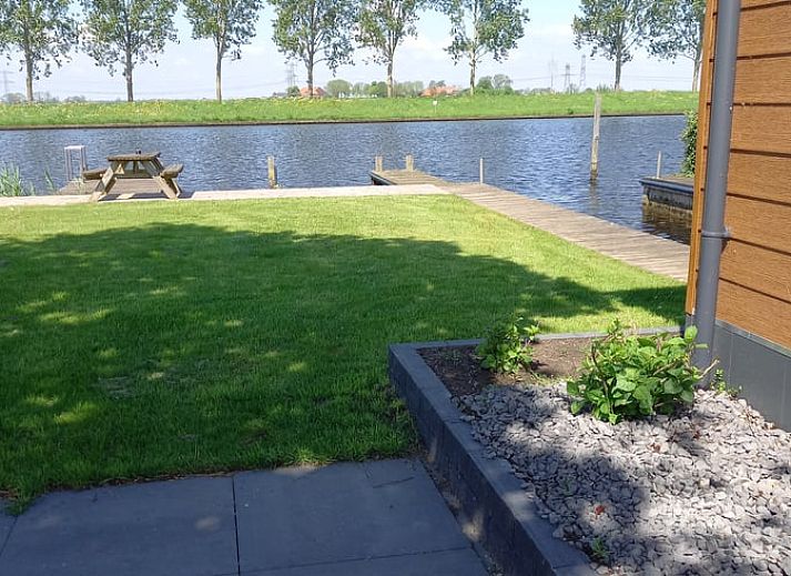 Enjoy the terrace at Holiday Home in IJsselmuiden, located on the water in Northwest Overijssel.