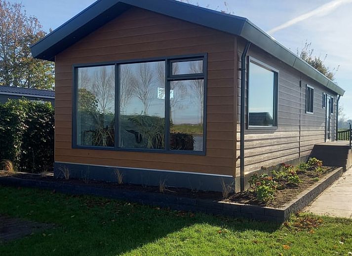 Enjoy the terrace at Holiday Home in IJsselmuiden, located on the water in Northwest Overijssel.