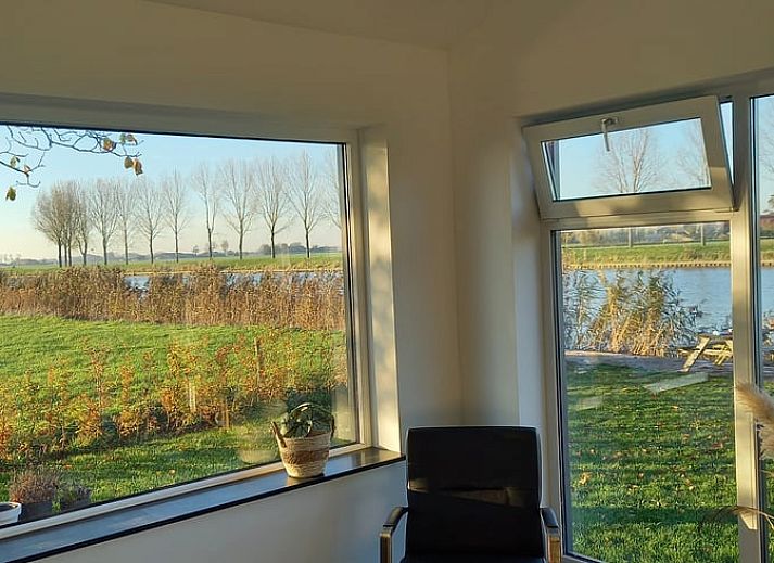 Relax at sunset on the dock of Holiday Home in IJsselmuiden, Overijssel.