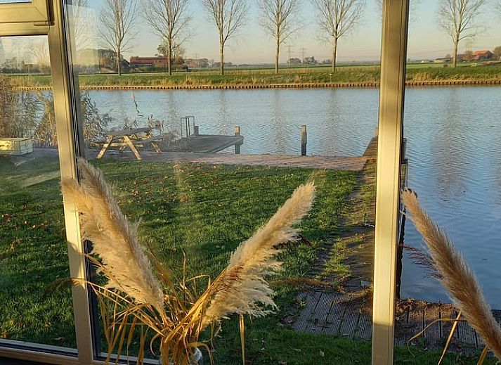 Relax at sunset on the dock of Holiday Home in IJsselmuiden, Overijssel.