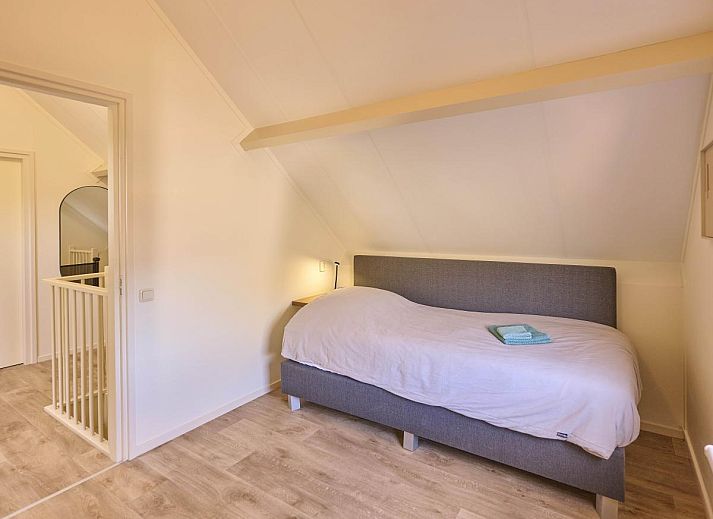Gezellige slaapkamer in Alpa Casa vakantiehuis, Rouveen, Overijssel met een comfortabel tweepersoonsbed.