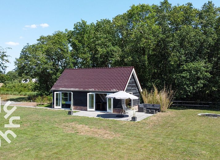 Vacation home OV473 in Baars, Northwest Overijssel, offers a serene setting with a spacious terrace and beautiful views of the surrounding nature.