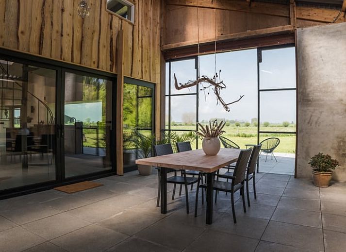 Cozy dining area in Holiday Home in Zalk overlooking the countryside of Northwest Overijssel.