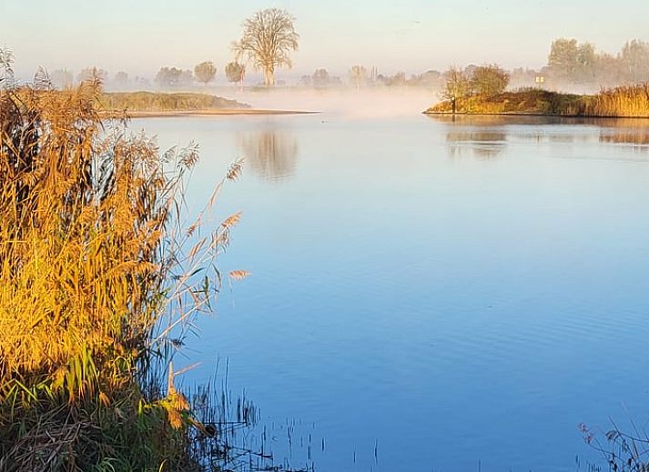 Cozy dining area in Holiday Home in Zalk overlooking the countryside of Northwest Overijssel.