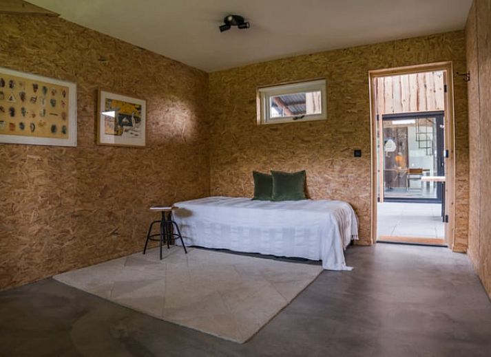 Modern interior space with spiral staircase in Holiday home in Zalk, perfect for a relaxing stay in Overijssel.