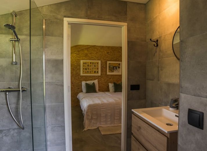 Modern interior space with spiral staircase in Holiday home in Zalk, perfect for a relaxing stay in Overijssel.