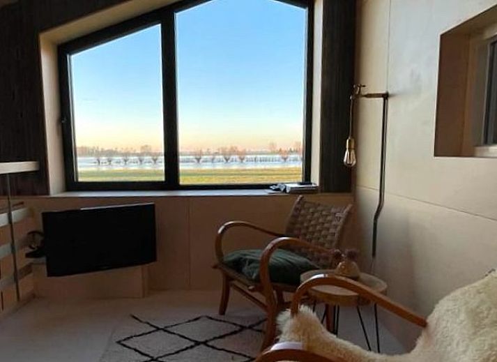 Modern interior space with spiral staircase in Holiday home in Zalk, perfect for a relaxing stay in Overijssel.