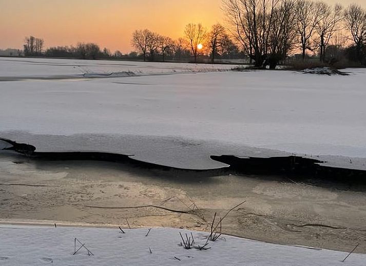 Open kitchen and dining area in Holiday Home in Zalk, Northwest Overijssel, ideal for socializing.