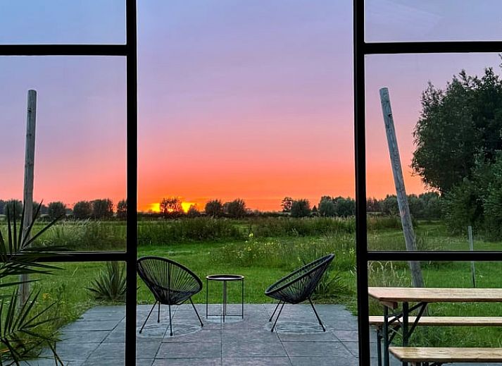 Open kitchen and dining area in Holiday Home in Zalk, Northwest Overijssel, ideal for socializing.