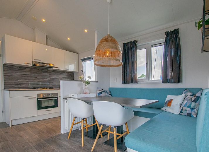 Purple Heron 24-34 chalet in Breukelen, Utrecht, with waterfront terrace and marina view, ideal for a relaxing vacation.