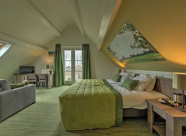 Rivierzicht bij Vakantiehuis in Vreeland, Utrecht, met aanlegsteiger en boten.