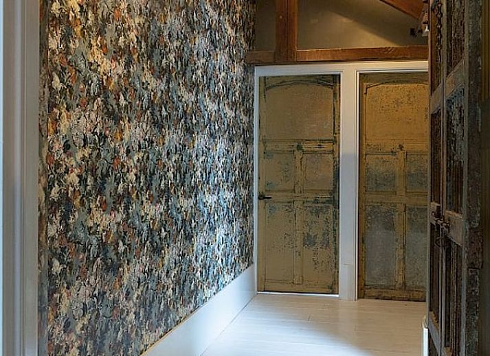 Decorative details in Cottage in Waverveen, Utrecht vacation home with books and bust.