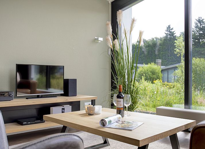 Lichte leefruimte in Amerongse Berg 4-persoons woning 4EL1 in Overberg, Utrecht, met comfortabele zitplaatsen.