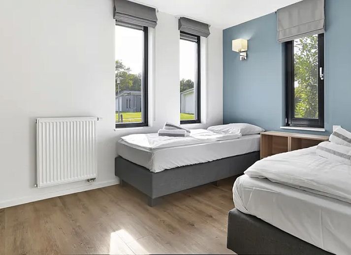 Comfortabele zithoek in de Amerongse Berg 4-persoons woning, perfect voor ontspanning in Overberg, Utrecht.