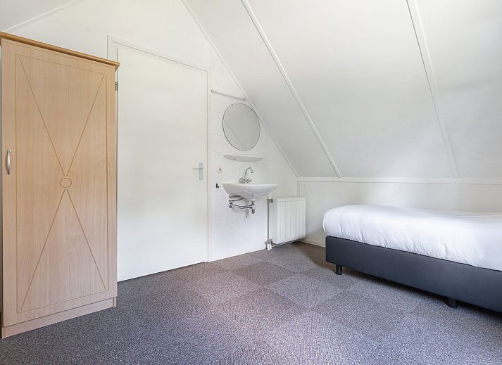Gezellige woonkamer in Vakantiewoning Beukenrode, Doorn, Utrechtse Heuvelrug, met comfortabele zithoek en moderne inrichting.